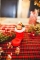 Mise en situation sur table décorée des 3 bougies botte du père noël avec ourson