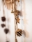 Détail de l étoile et des paillettes de la suspension pommes de pin et étoiles bois pour décoration paillettes cuivre
