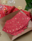 Vue en éventail des serviettes en papier de Noël rouge flocon d or